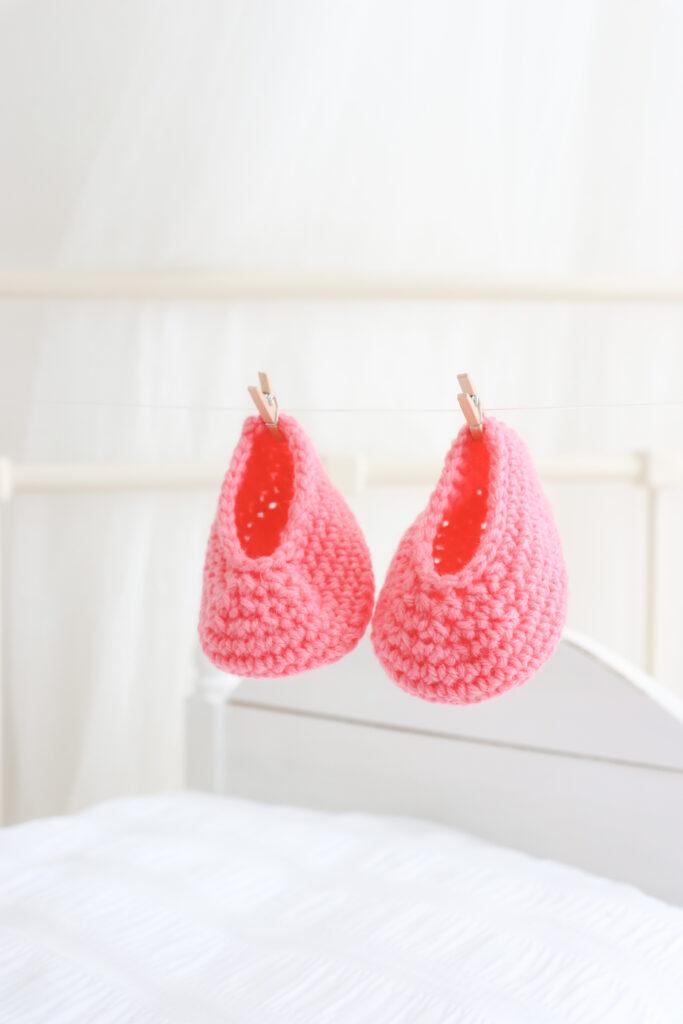 a pair of crochet baby booties