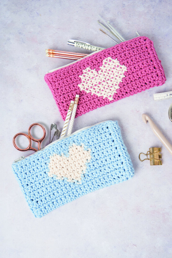 crocheted pencil case with cross stitch heart on top