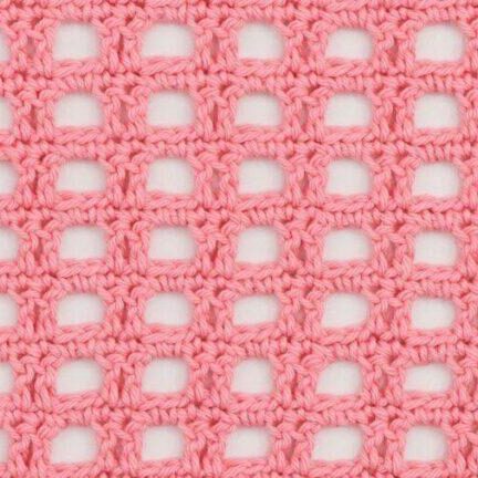 Pink crocheted mesh fabric with a square, openwork pattern